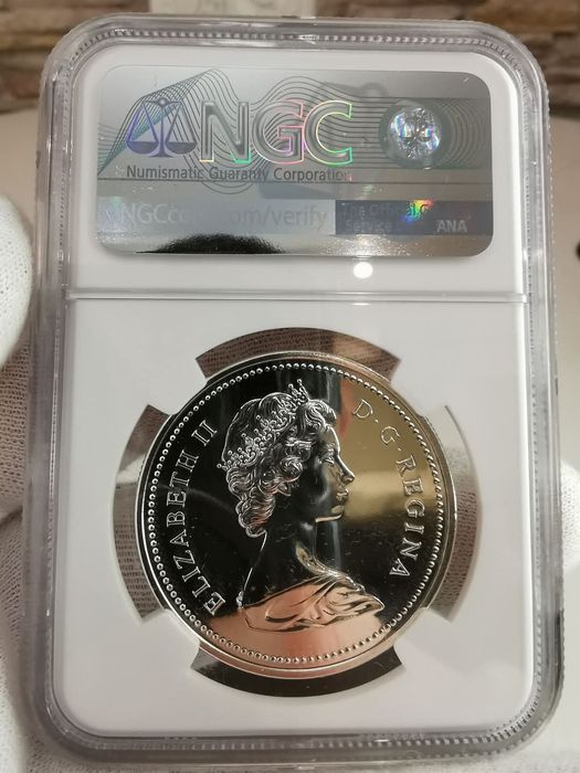 КАНАДА 1 долар 1975р. 100років м. Калгарі. СРІБЛО. NGS SP69 СЛАБ.