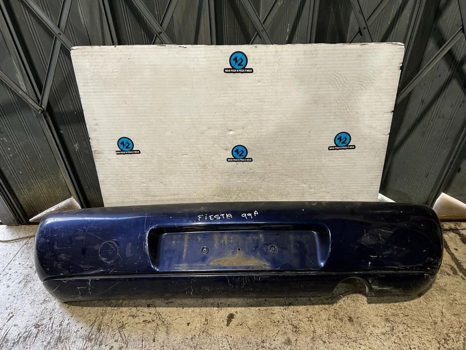 Parachoques traseiro Ford Fiesta 1999