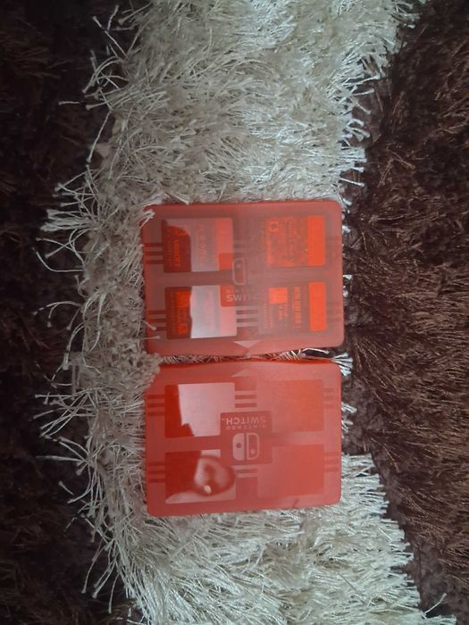 nitendo switch , jogos/com as caixas , com mini caixa para guardar , carregador usb , correias straps etc
