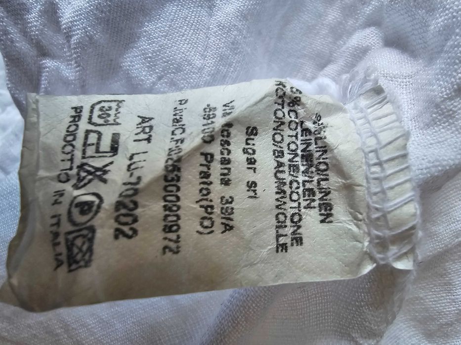 Spodnie lniane z guzikami na kieszeniach