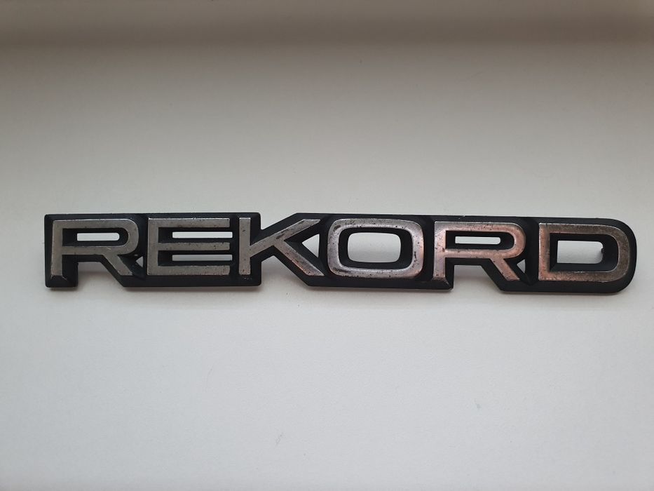 Opel Rekord emblemat napis