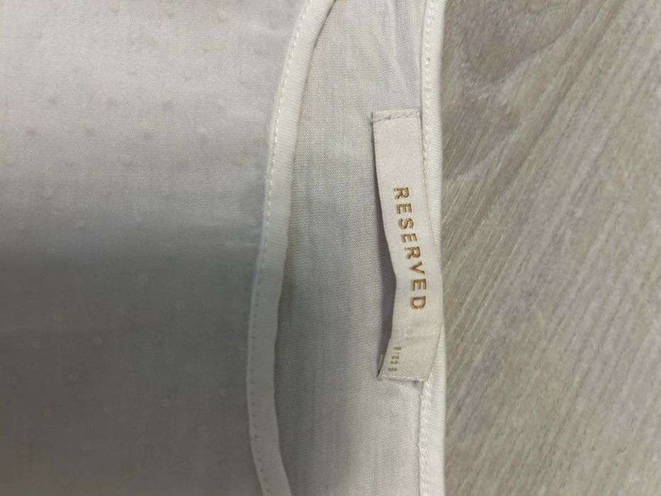 # Reserved bluzka krótki rękaw przezroczysty przód