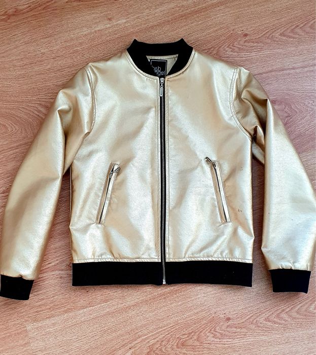 Куртка золотого кольору на 9-12 років