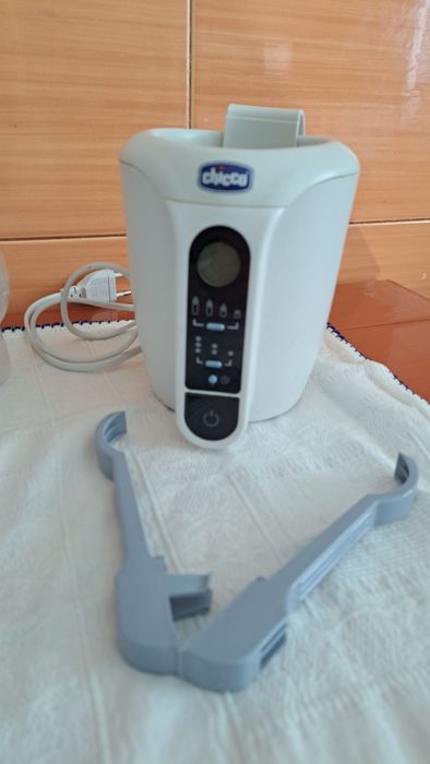 Extrador de leite e aquecedor de biberões