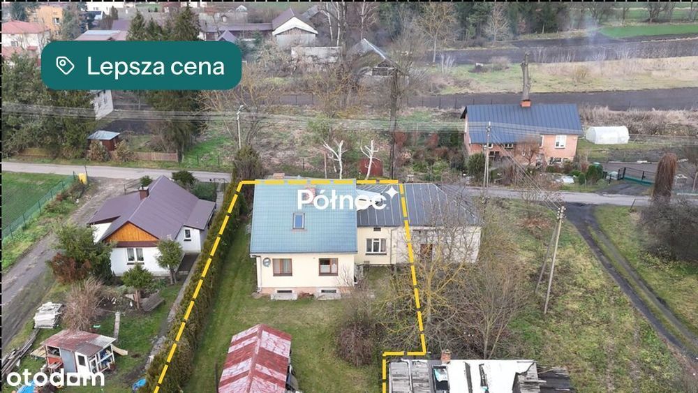 Dom przy spokojnej ulicy, nad rzeką.