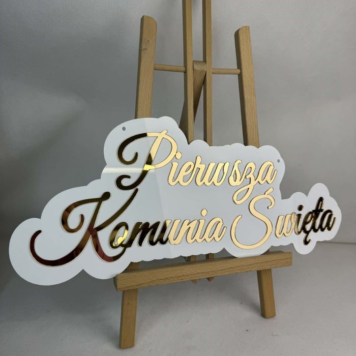 Biało złoty napis na komunie