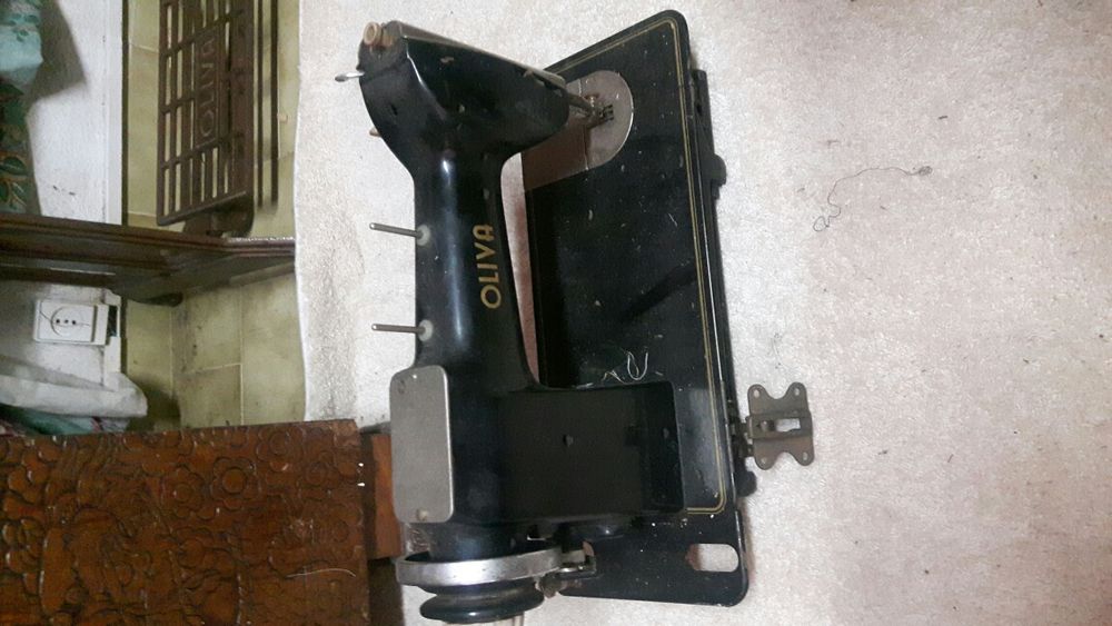 Cabeça de máquina costura Oliva