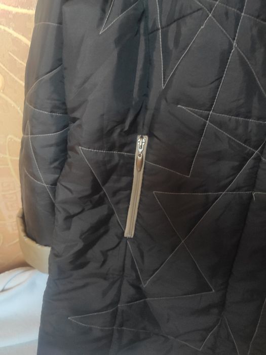 Жіноча зимова куртка 52 розміру.