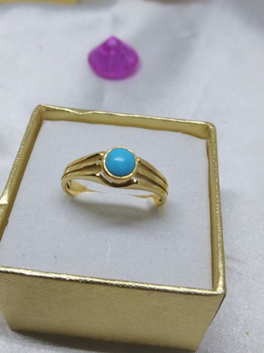 Piękny złoty pierścionek niebieskie oczko, złoto 333, r. 14