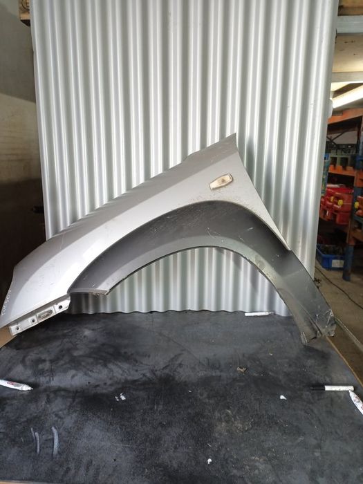 Guarda Lamas Hyundai Tucson MK1 ESQUERDO  Cinza