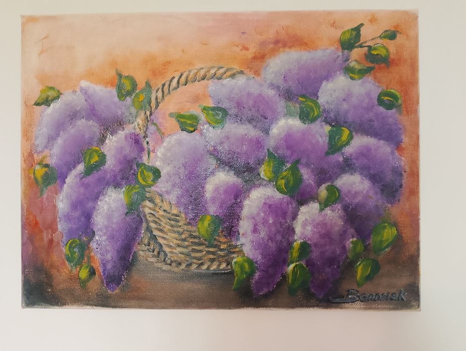 Obraz kwiaty bzu w wiklinowym koszu