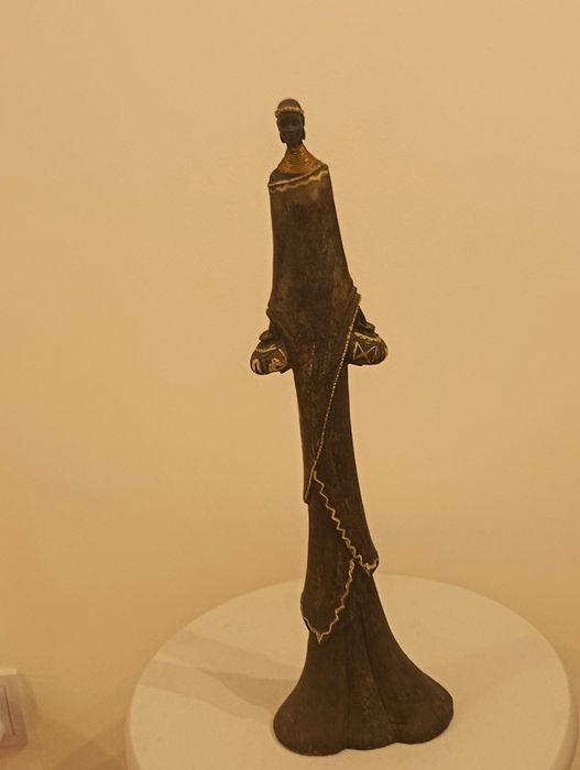 Agroturystyka  figurka  przedstawiająca postać