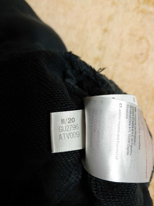 Damskie spodnie dresowe cargo Adidas