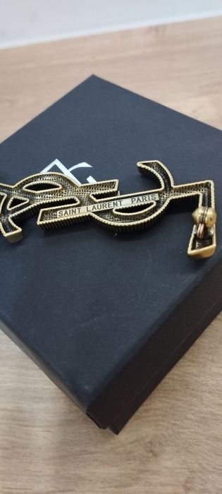Używana broszka YSL Saint Laurent Paris w kolorze złotym duża