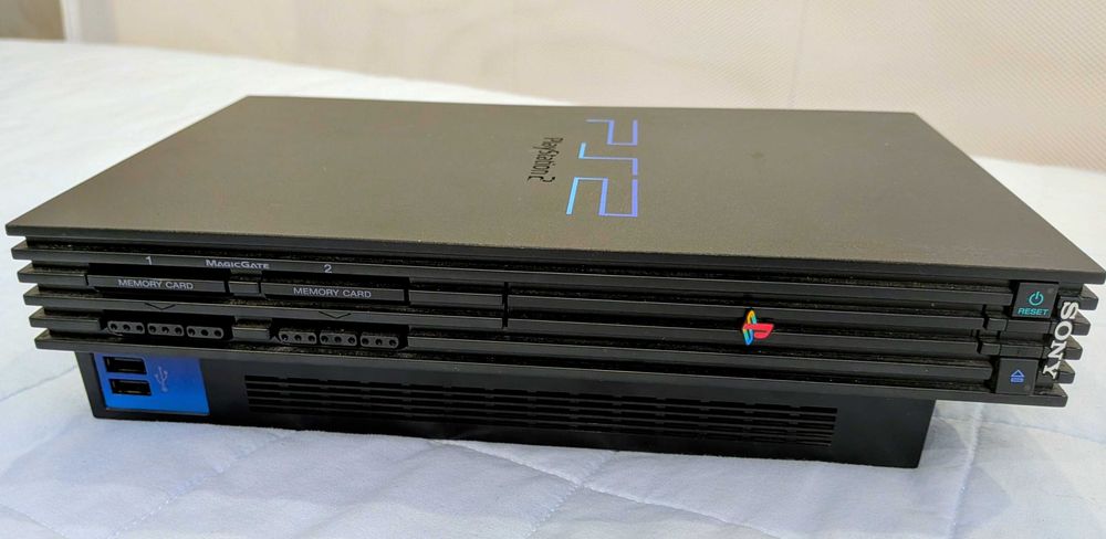 Playstation 2 + jogos + 1 comando + cartão de memória