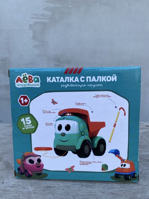 Музична Вантажіка Льова іграшка каталка з палицею / Грузовичок Лёва