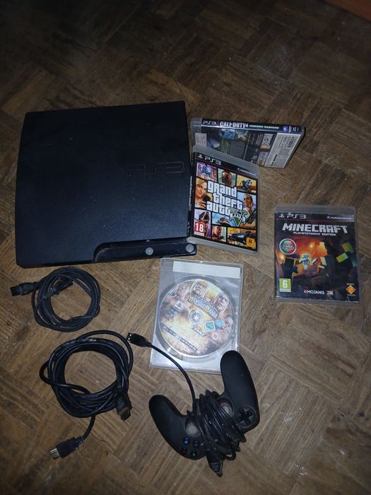 Ps3  com 4 jogos e um comando