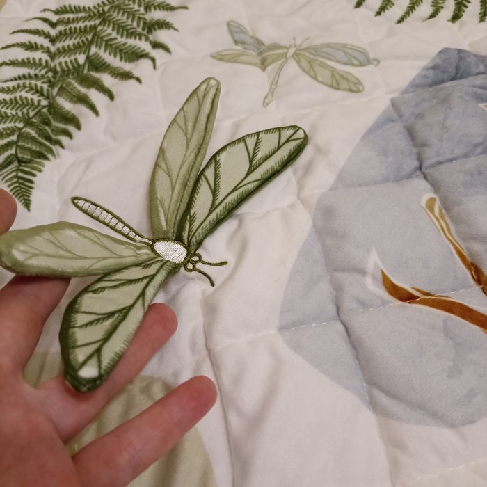 Сенсорний навчальний килимок Skiddou з помпонами