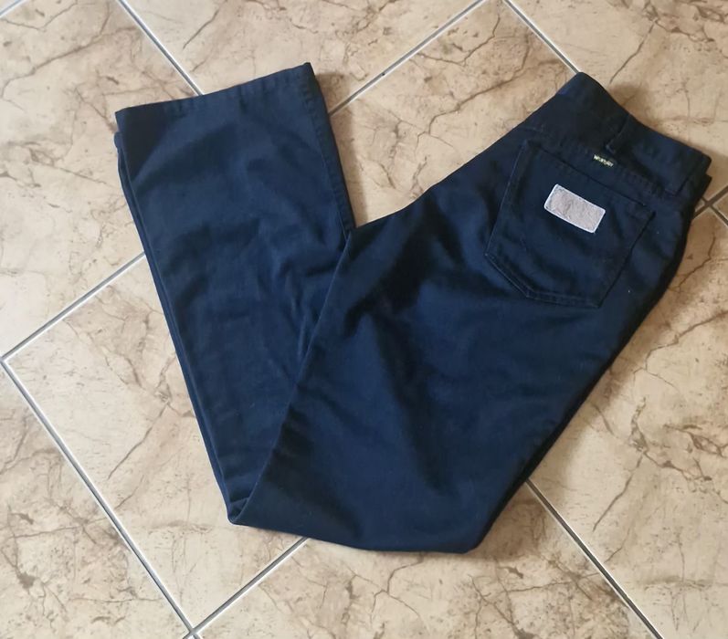 Spodnie wrangler model z szeroką nogawka rozm 33 - 34