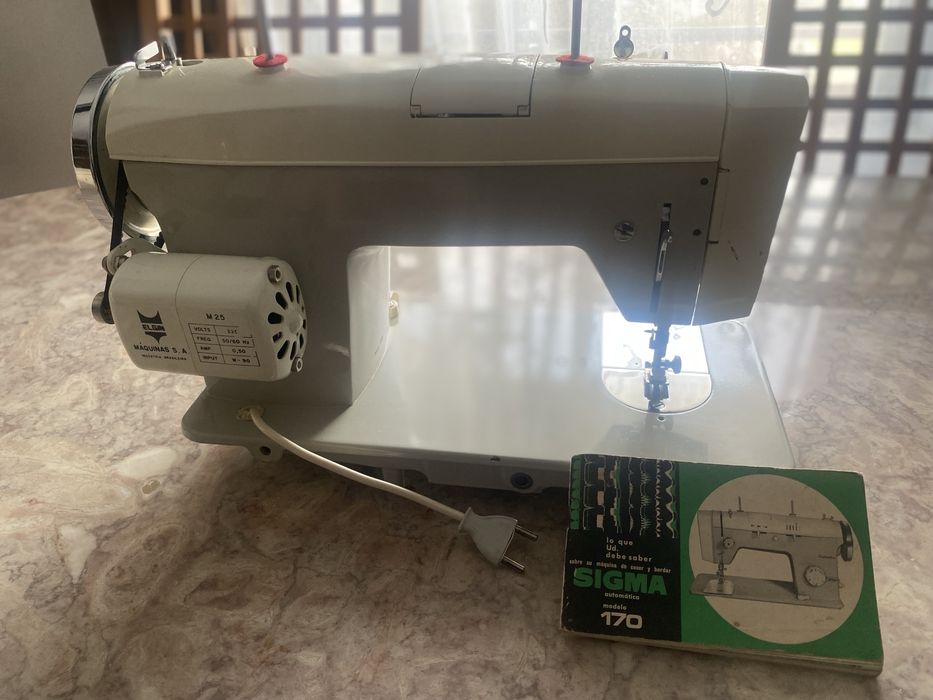 Maquina de cozer e bordar automatica