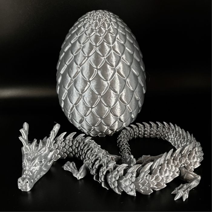сріблястий рухливий дракон у яйці 3д іграшка