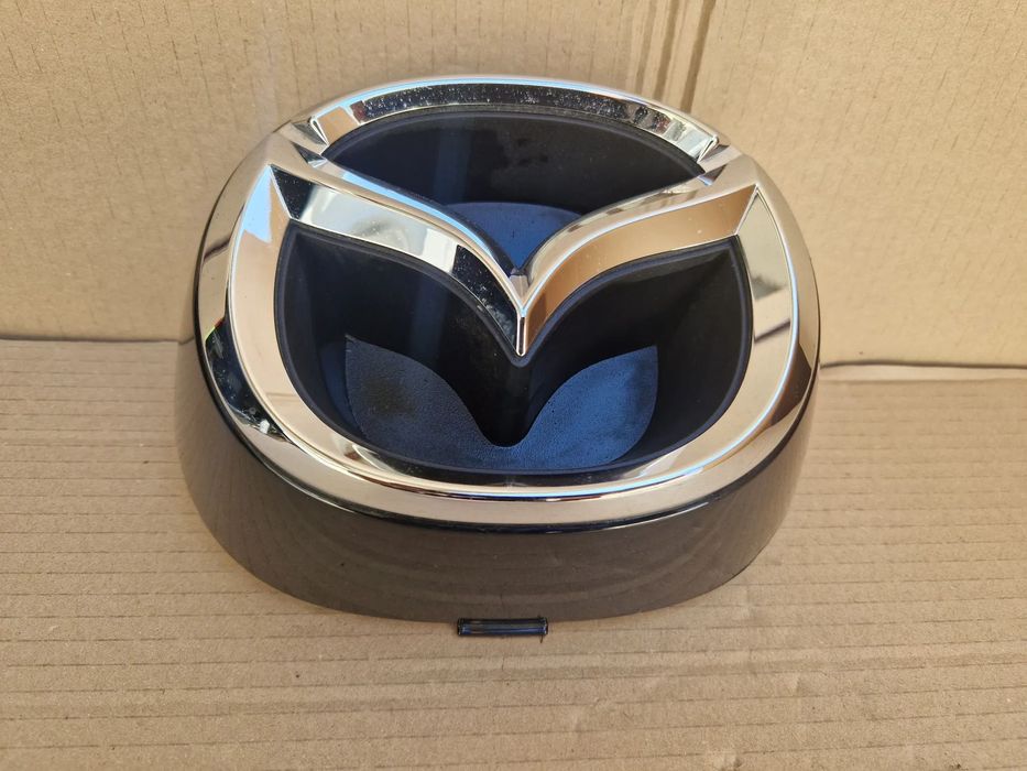 MAZDA CX-5 CX5 1 I 2 II KF EMBLEMAT ZNACZEK PODSTAWA WSPORNIK ATRAPA ZNACZKA GRIL GRILLA KB8A50721