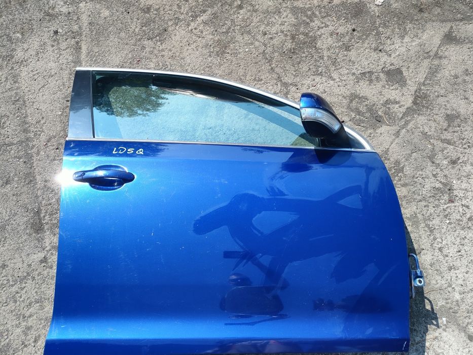 Volkswagen Jetta mk5 drzwi prawy przód niebieskie LD5Q
