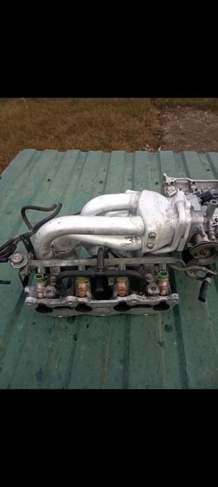 Колектор .мазда 323f BA.