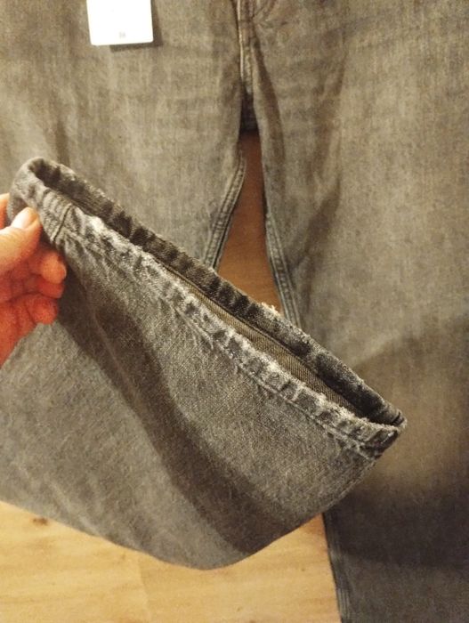 Męskie czarne spodnie jeansowe flare Zara r.44