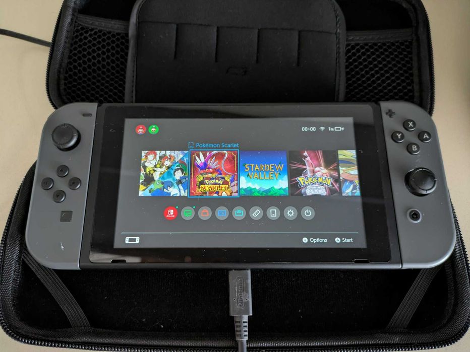 NIntendo Switch 1 c/ dock, comando e jogos