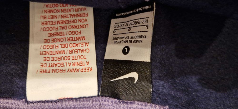 Ciepłe fioletowe spodnie dresowe Nike 152/158