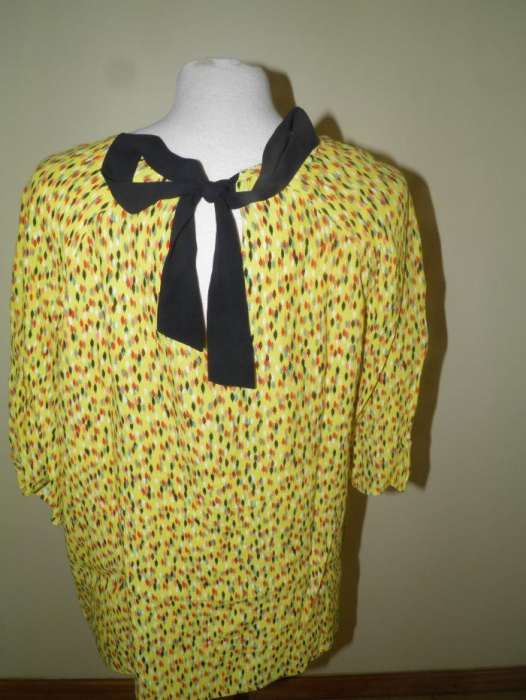 Camisa ¾ de manga, muito leve, jovial e eclética