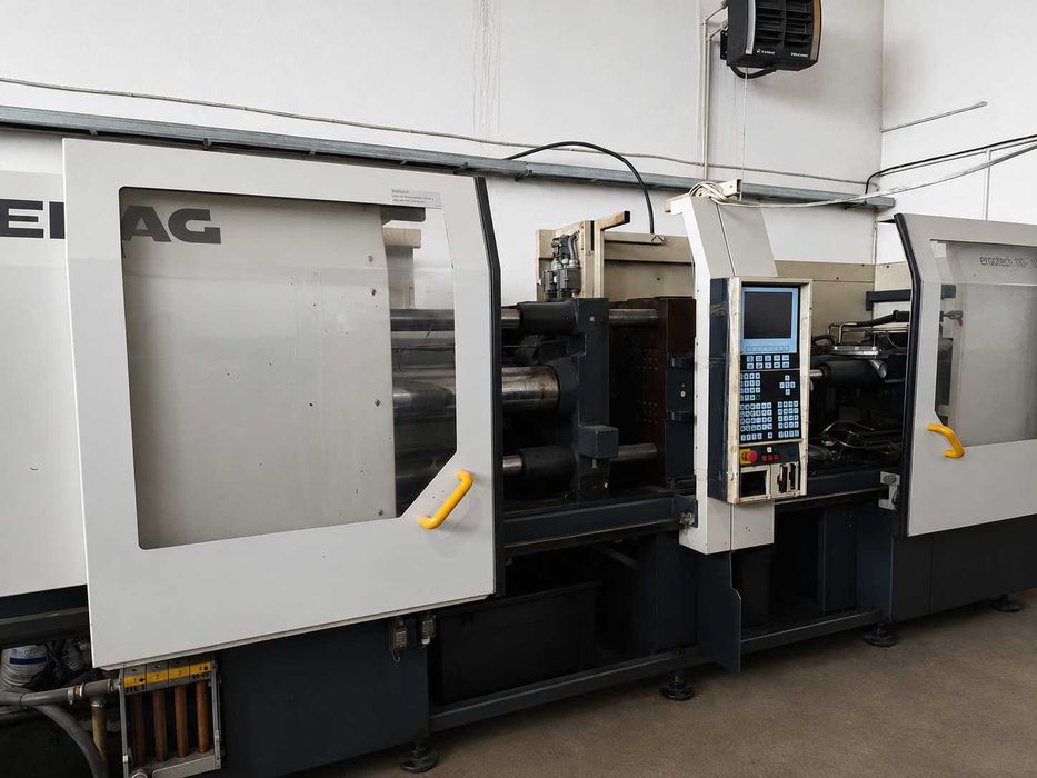 Mannesmann Demag ErgoTech System 1100-310 — ТПА 110 тонн з роботом Wittmann