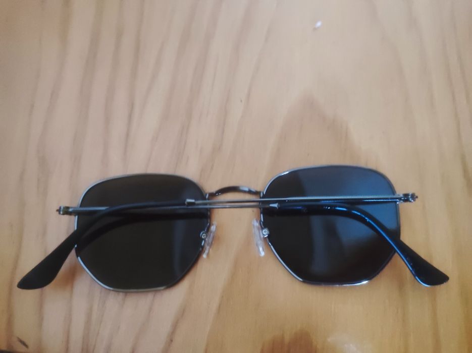 Óculos sol marca reflexo