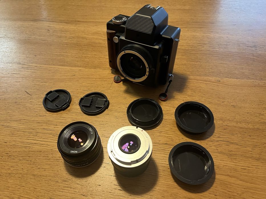 Nons SL660 (instax), mocowanie EF, obiektywy 50/1.8 oraz 35/2.4