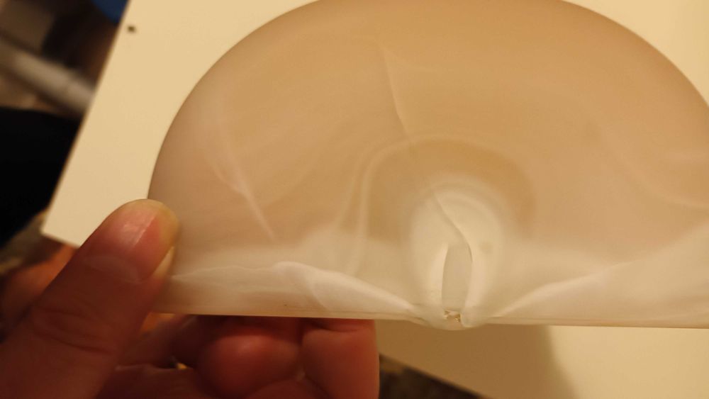 Elegancki kinkiet imitacja lampy solnej