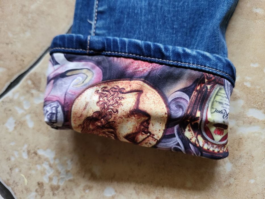 Spodnie dżinsowe L z ozdobnymi mankietami