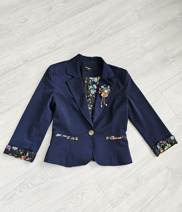 Piękna granatowa marynarka L 40 broszka