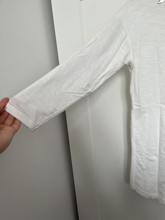 Biała bluzka z rekawem 3/4 i celinami