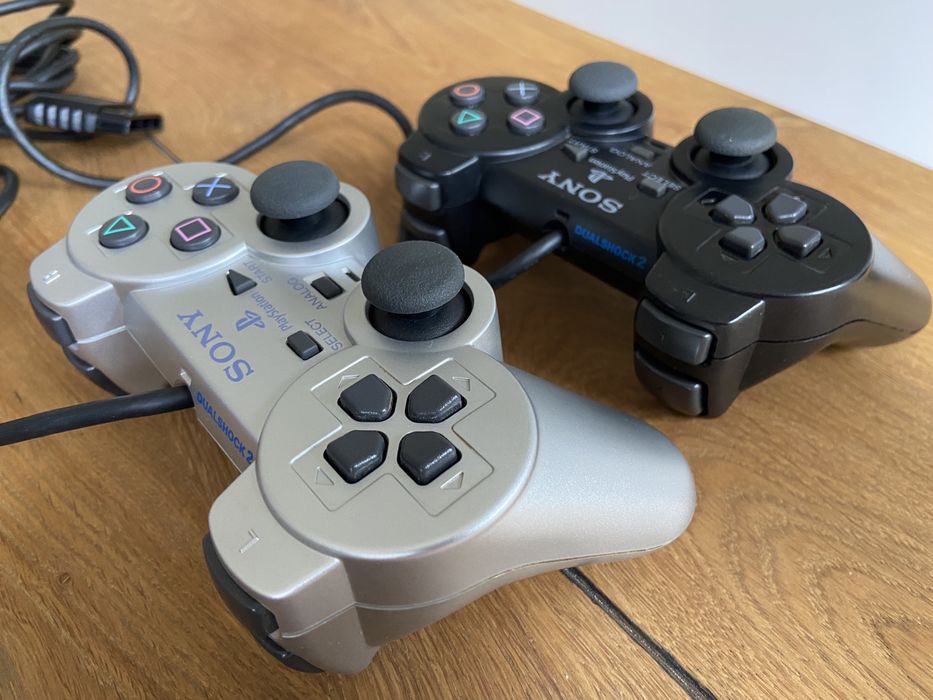 Selling PS2 Slim with vertical stand, 2 controllers, and 7 games64409139350786123