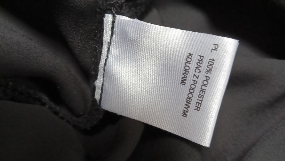 Czarny kombinezon KappAhl