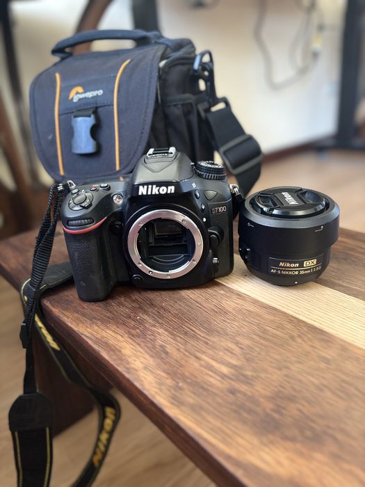 Camera Nikon D7100 + Objetiva Nikon AF-S DX Nikkor 35mm plus bolsa