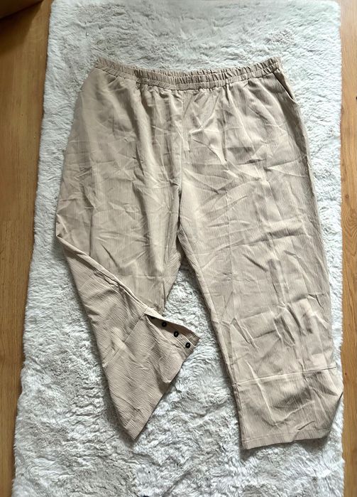 Piękne beżowe spodnie 7/8