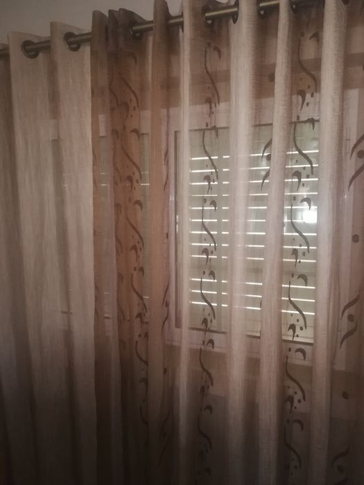 Conjunto de cortinados com argolas