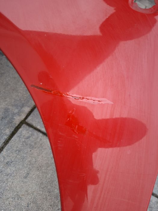 Skoda fabia 2 roomster blotnik przedni lewy czerwony lf3k