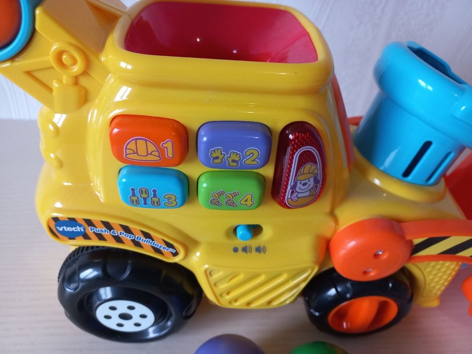 Розвиваюча іграшка каталка Бульдозер від VTech Pop a Balls Push & Pop