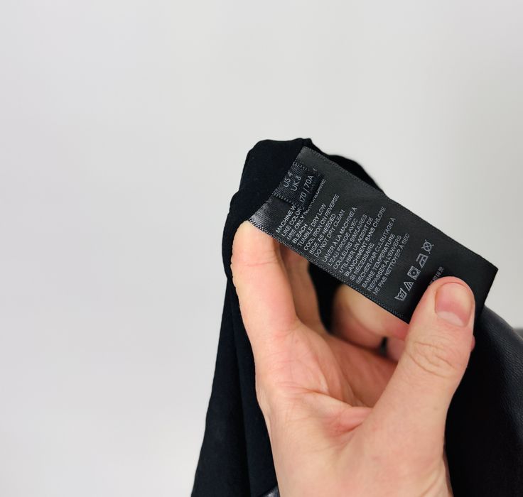 Czarna skórzana mini spódnica z guzikami S 36