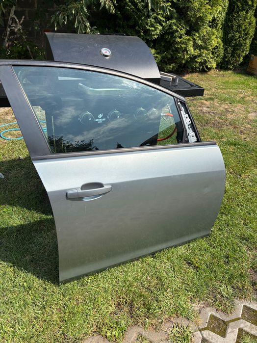 Drzwi Przód Prawe Opel Astra J Srebrne / Szare (Szyba, Klamka, Głośnik)