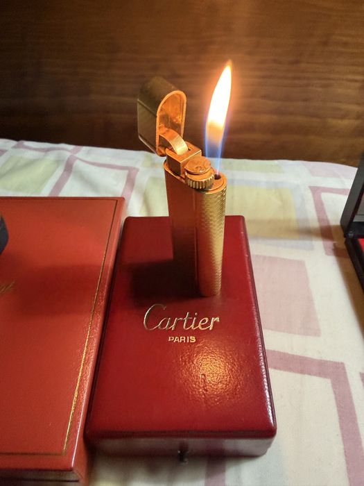 11 isqueiros 4 Dupont 1 Cartier 1 Dunhill 2 Ronson 2 Zippo 1 Zaima