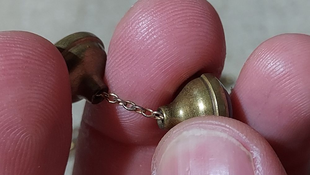 Botões de punho com prendedor